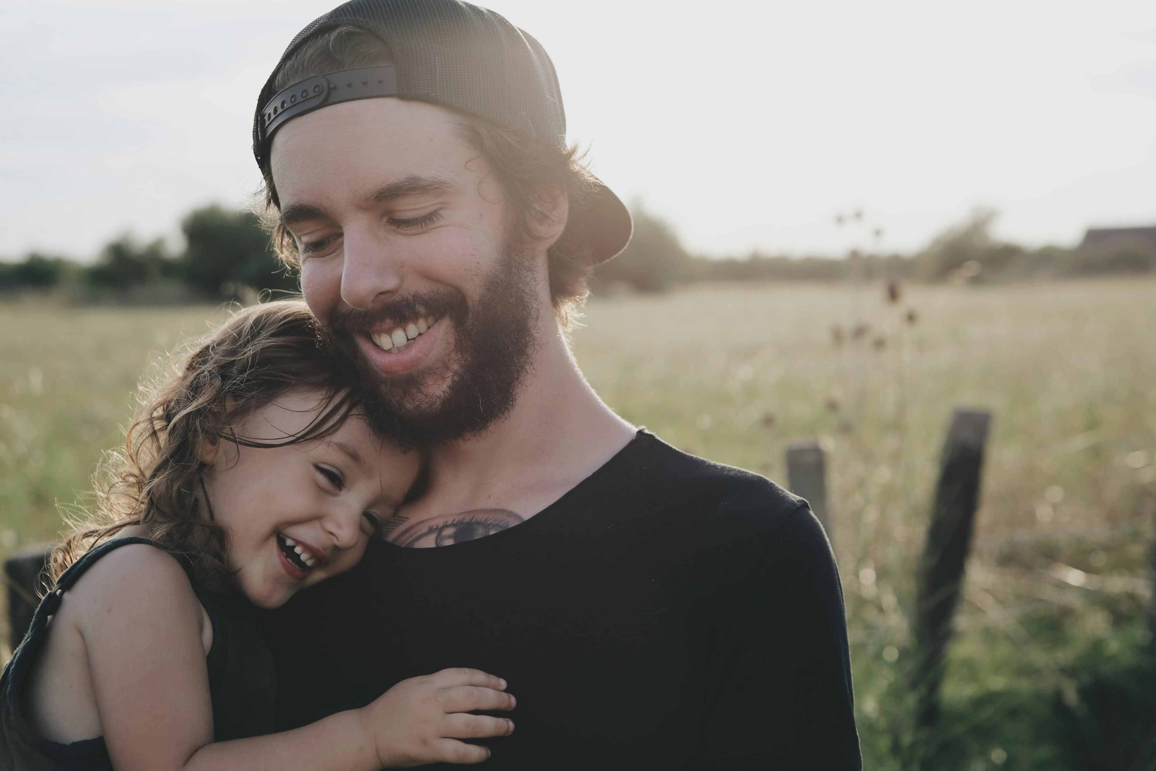 Father holding his daughter